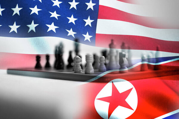 Concept of Bilateral relationship between two countries showing with two flags: United States of America and North Korea. High quality photo