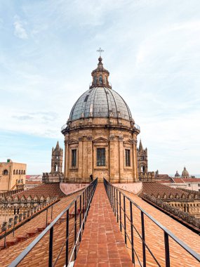 Close view at the dome and roof of Palermo Cathedral. The city is spread underneath. It's characterised by the presence of different styles.