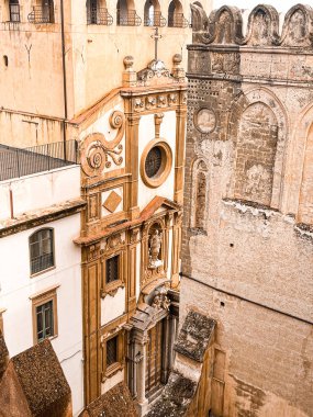 Close view at the dome and roof of Palermo Cathedral. The city is spread underneath. It's characterised by the presence of different styles.