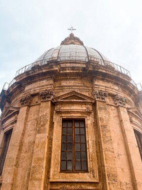 Close view at the dome and roof of Palermo Cathedral. The city is spread underneath. It's characterised by the presence of different styles.