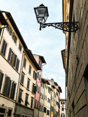 Narrow streets of an old town of Florence. No people. Buildings are of a colour of sand.