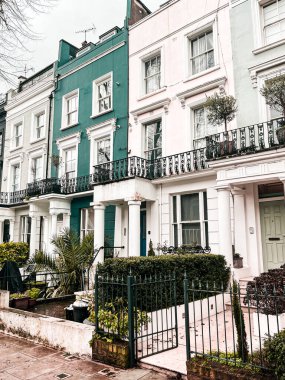 Residential streets of Notting Hill with colourful houses. Bright and coloured facade of these houses bring up the cultural uniqueness of this area.