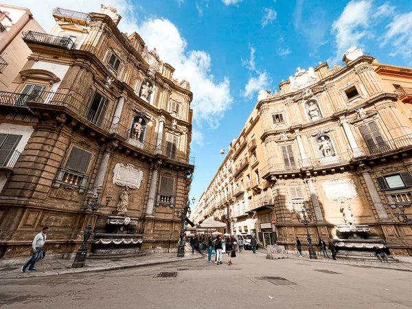 Quattro Canti, or officially Piazza Vigliena, in Palermo. Fontains represent different seasons. Buildings have sculptures of kings and saints.
