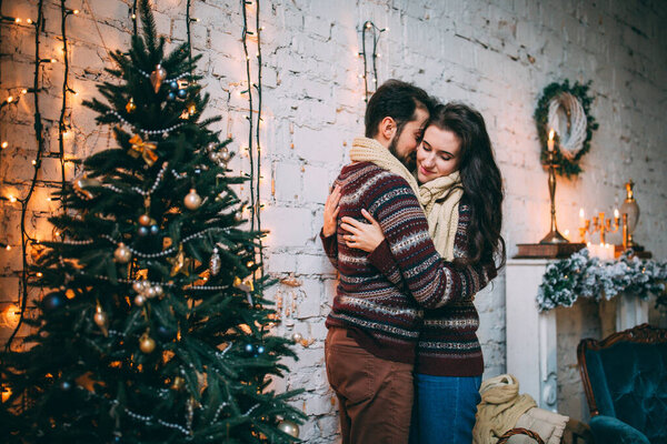 family portrait love story photo session in christmas decorated studio