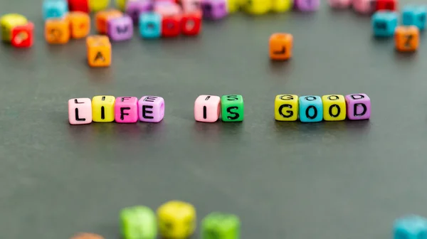 Life Good Slogan Multicolor Letter Block Beads Front View Motivation — Stock Photo, Image