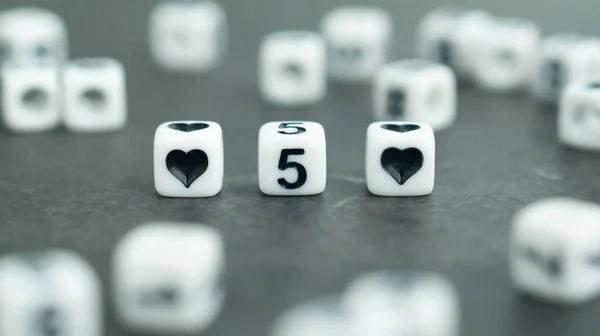 number 5 five in white letter block beads. Fifth anniversary. Marriage anniversary concept. High quality photo