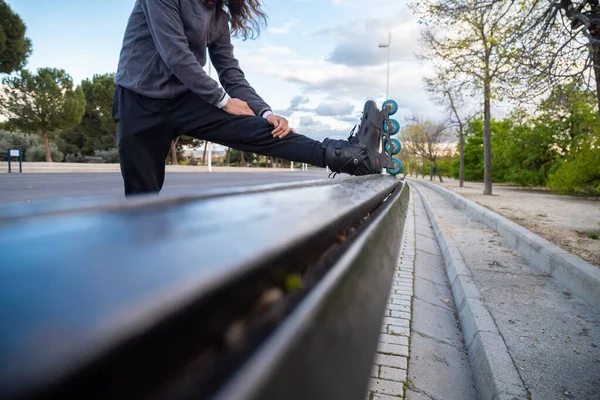 Side View Young Cool Man Sportswear Roller Skates Stretching Bench — Stock Photo, Image