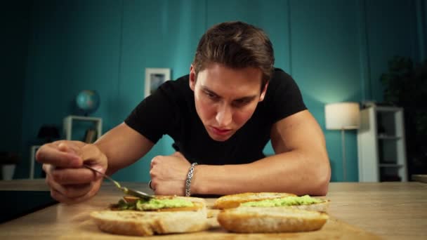 Man Prepares Avocado Sandwiches Kitchen Home Guy Cooks Delicious Delicious — Stockvideo