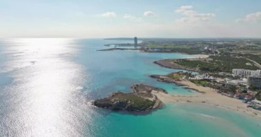 Aerial view background video of a sandy beach on the seashore. Beautiful nature landscape on the ocean shore. High quality 4k footage