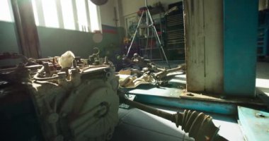 Lift and parts for cars at the technical service station. Car repair by professionals. High quality 4k footage