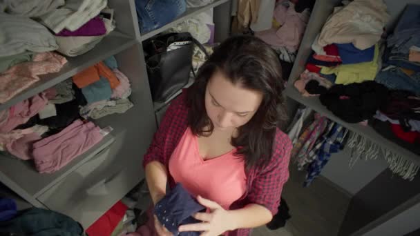 Woman Folds Clothes Wardrobe Perfectionist Girl Cleans Room Puts Shirts — Stock Video