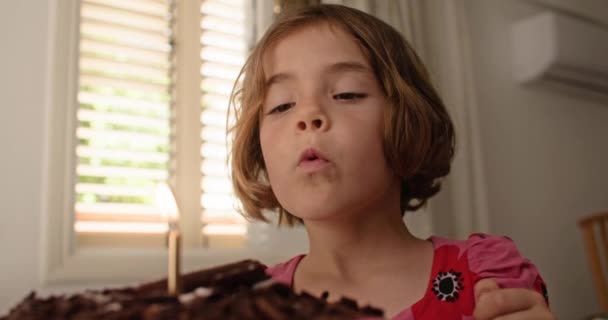 Lifestyle Caucasian Child Blowing Out Candle Birthday Cake Happy Smiling — Stock Video