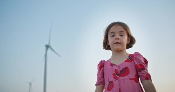 Future Guardians Captivating Footage Child Standing Wind Turbines Embracing Concept — Stock Video