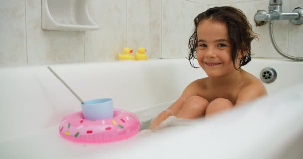 Girl Bathes Bathtub Toys Smiling Happy Child Washing Himself Water — Stockvideo