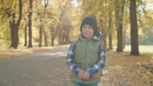 Classroom Bound Young Scholar Hurries Autumn Foliage High Quality Footage — Stock video