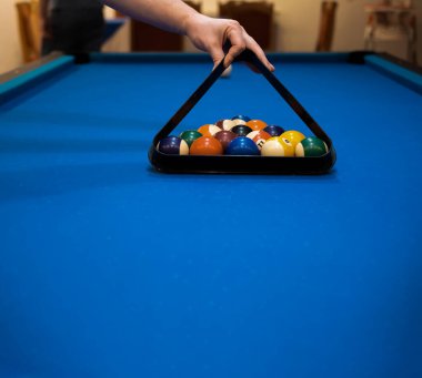 Multicolored billiards, billiard balls on a blue table, colored balls on a billiard table, Russian billiards, play snooket