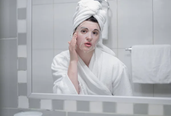 Young Caucasian Woman White Bathrobe Towel Her Head Removes Moisturizing — 图库照片