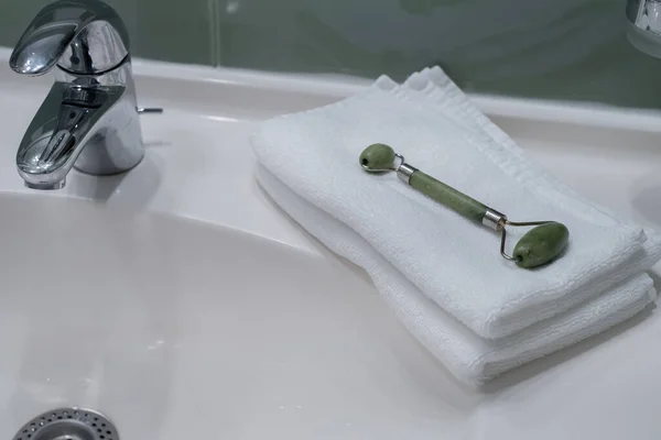 Stack Fresh Towels Face Roller Cream Countertop Bathroom — Stockfoto