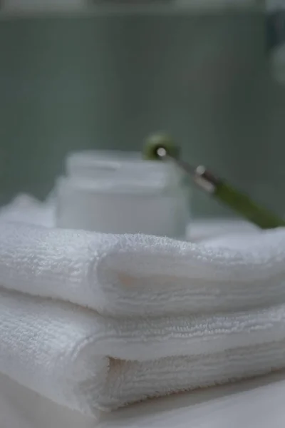 Stack Fresh Towels Face Roller Cream Countertop Bathroom — Φωτογραφία Αρχείου