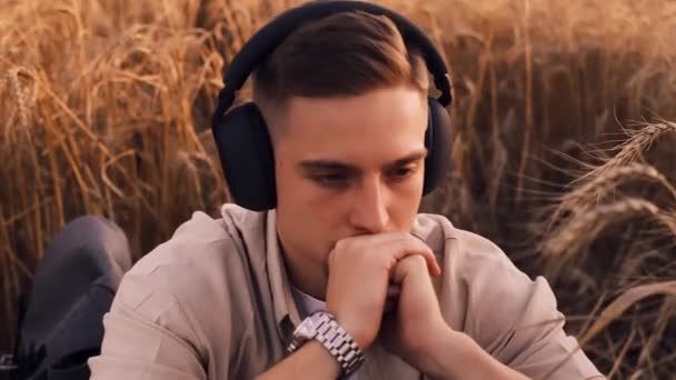 Young Guy Headphones Enjoying Listening Music Outdoors City Park Backdrop — Stock Video