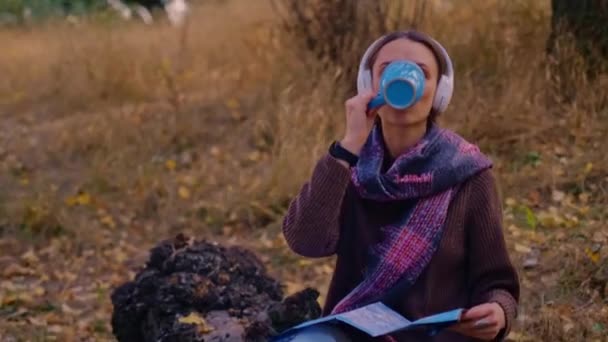 Woman Backpack Drinks Tea Cup Dressed Brown Sweater Holds Map — Stock Video