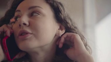 Girl in a restaurant talking on the phone