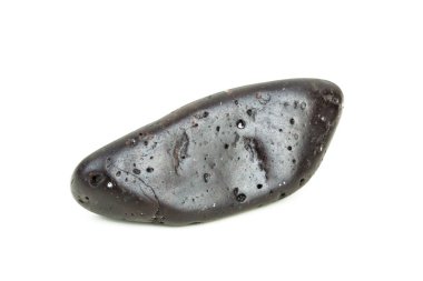 Atmosferik giriş ısıtmasının akış çizgilerini gösteren tektitin makro görüntüsü.