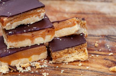 Rustic style millionaires shortbread blocks with crumbs