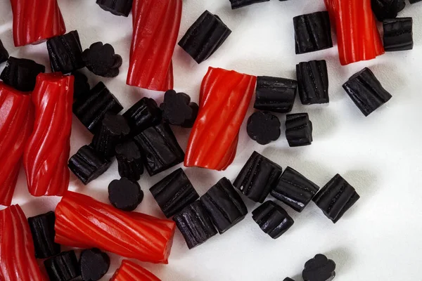 mixed red and black licorice, top view with copy space