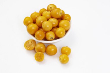 Cape gooseberries in small white bow isolated on white with copy space