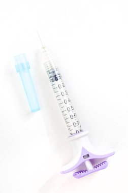 special syringe for aesthetic face fillers. Isolated on white with copy space clipart
