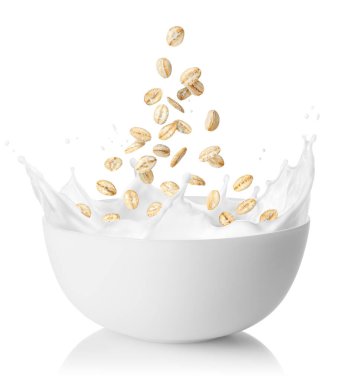 oat flakes falling in bowl with splashing milk isolated on white background