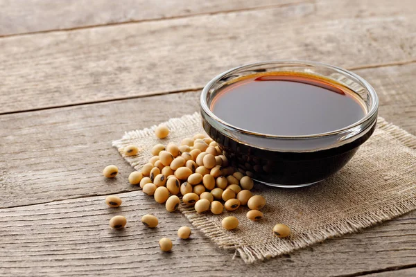Soy Sauce Glass Bowl Dry Soybeans Gray Wooden Table — Stock Photo, Image