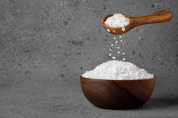 Sea Salt Crystals Falling Wooden Spoon Bowl Grey Background Stock Image