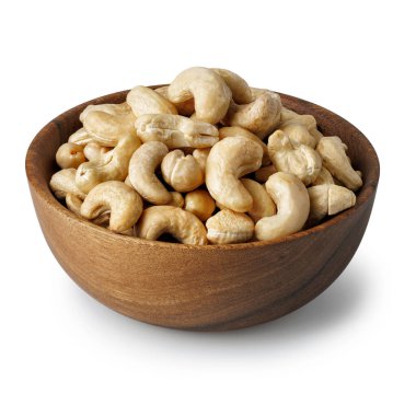 Cashew nuts in wooden bowl isolated on white background. File contains clipping path