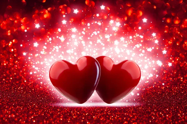Festive background for valentine\'s day. Two Hearts On Red Glitter and Shiny Background with sparkles and bokeh. Concept Valentine\'s day.