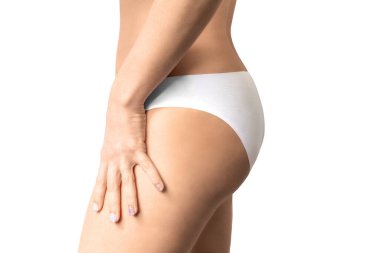 Side view of woman dressed in white panties.