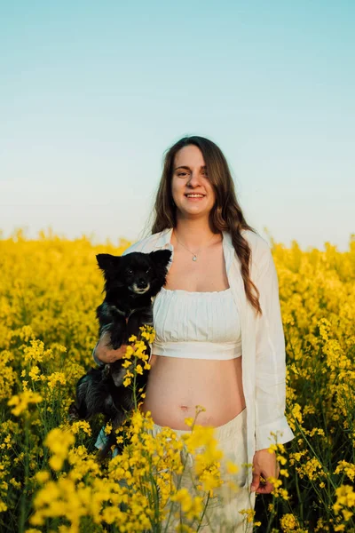 Pregnant Woman Small Black Dog Nature Rapeseed Field High Quality — Photo