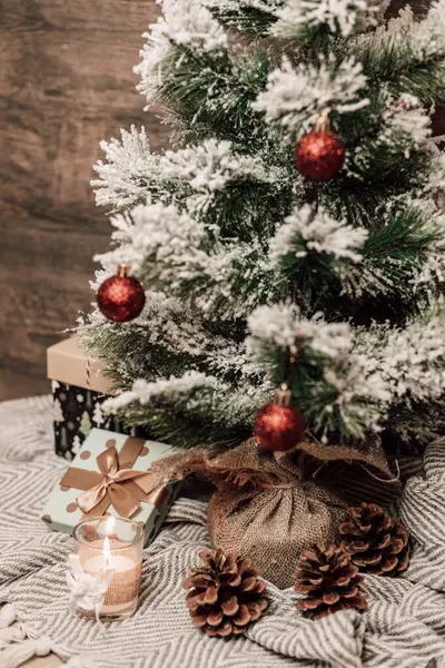 New Year\'s food with gifts and a candle on the table. Christmas atmosphere in the interior. High quality photo