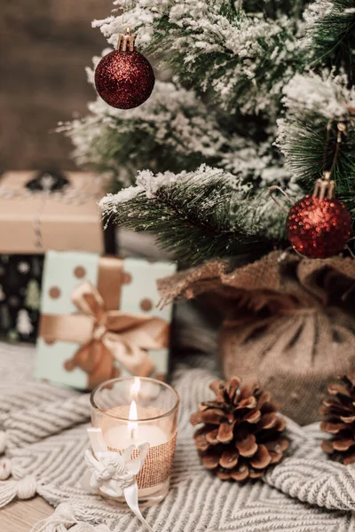 New Year\'s food with gifts and a candle on the table. Christmas atmosphere in the interior. High quality photo