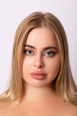 The face of a beautiful young blonde woman. Emotional portrait. High quality photo clipart