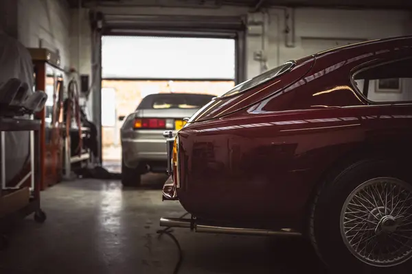 stock image Classic cars being restored in a vintage vehicle garage workshop