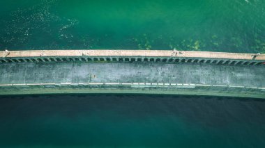 Aerial view of stone bridge connecting land and lighthouse by Newhaven port, East Sussex, UK