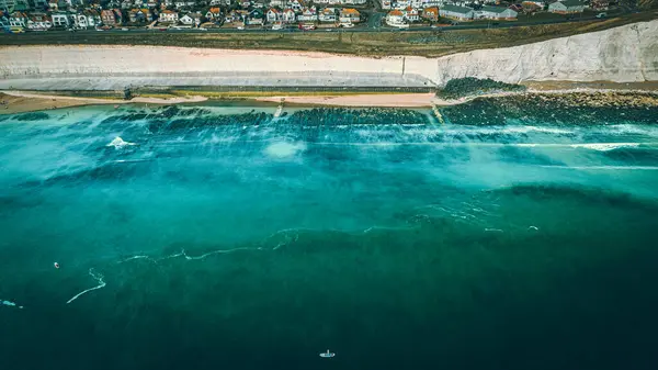 Aerial view of Rottingdean and Brighton coast blue waters, East Sussex, UK.
