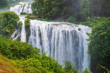 The Cascata delle Marmore (Marmore Falls) is a man-made waterfall created by the ancient Romans located near Terni in Umbria region, Italy. clipart