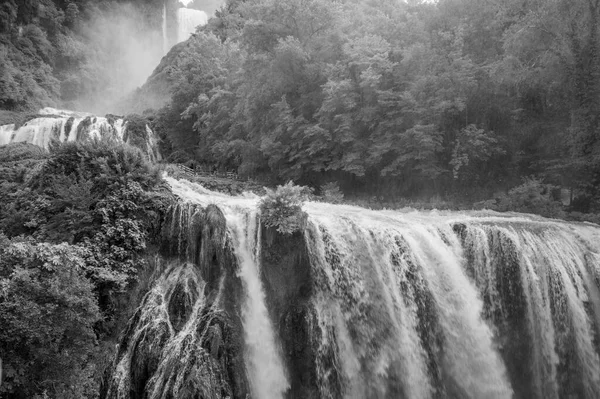 stock image Black and white photo of the Cascata delle Marmore (Marmore Falls) is a man-made waterfall created by the ancient Romans located near Terni in Umbria region, Italy.