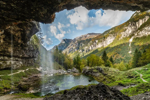 stock image Waterfall called Fontanon di Goriuda seen from inside the cave