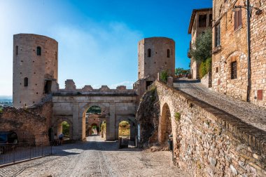 Medieval architecture of village in Umbria, magic of Spello. clipart