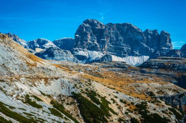 The Tre Cime di Lavaredo also called the Drei Zinnen are three distinctive battlement-like peaks, in the Sexten Dolomites of northeastern Italy.