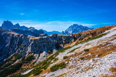 The Tre Cime di Lavaredo also called the Drei Zinnen are three distinctive battlement-like peaks, in the Sexten Dolomites of northeastern Italy.